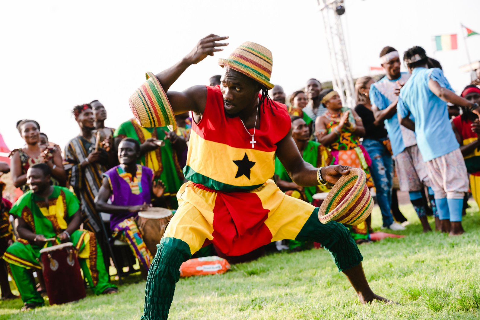 Performer in Costume Dancing on Ground at a Festival